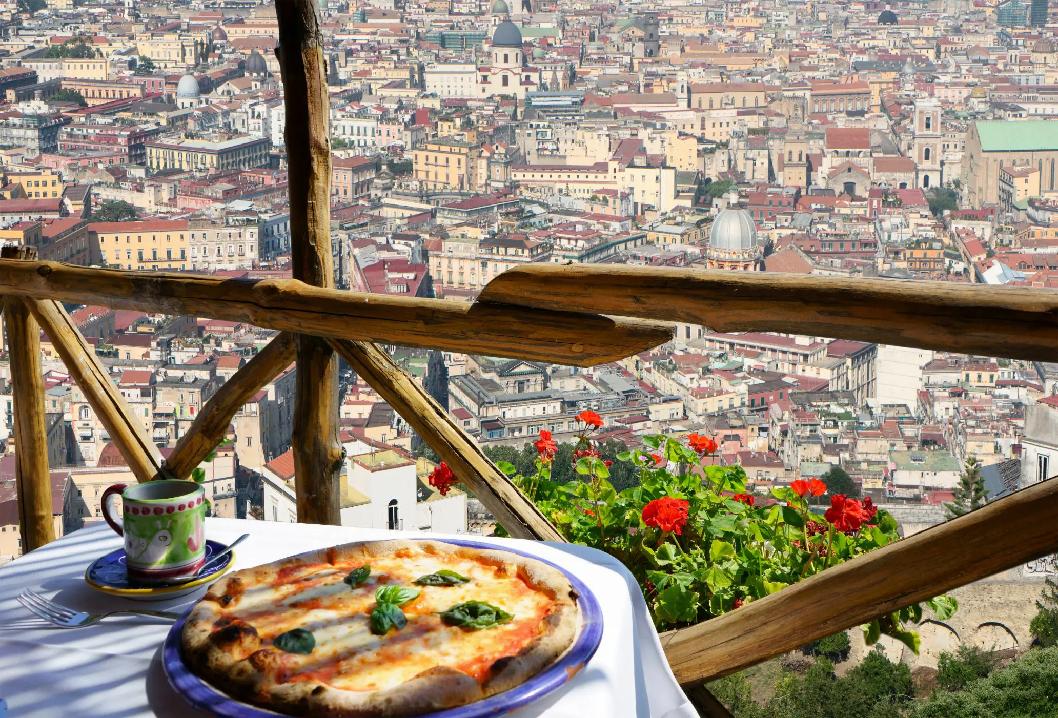 Pizza On Balcony With Naples In Background
